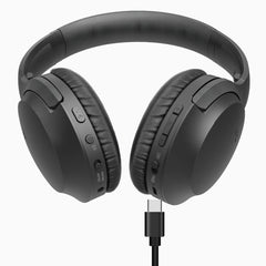 Opera Wireless TV Headphones with transmitter and charging dock, featuring independent volume control, on/off switch, EQ modes: Balanced and Clear Voice, with USB-C charging port.