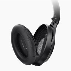 Opera Wireless TV Headphones with transmitter and charging dock, featuring replaceable earpads.